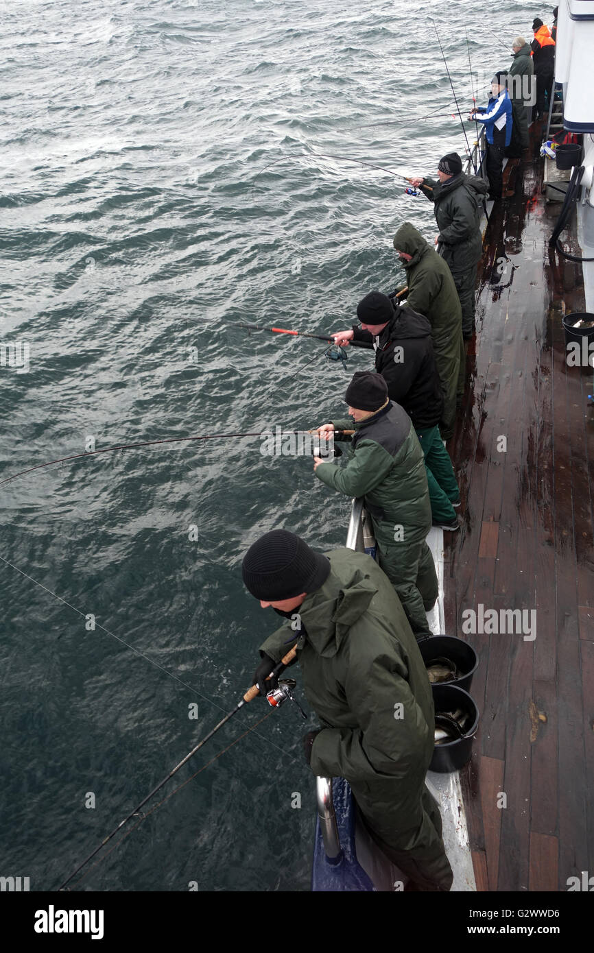 16.02.2014, Wismar, Mecklenburg-Western Pomerania, Deutschland - Männer am Hochseeangeln an der Ostsee. 00S140216D006CAROEX. JPG - nicht für den Verkauf in G E R M A N Y, A U S T R I A S W I T Z E R L A N D [MODEL-RELEASE: Nein, PROPERTY-RELEASE: Nein, (C) Caro Fotoagentur / Sorge, http://www.caro-images.com, info@carofoto.pl - jegliche Nutzung dieses Bildes unterliegt GEMA!] Stockfoto