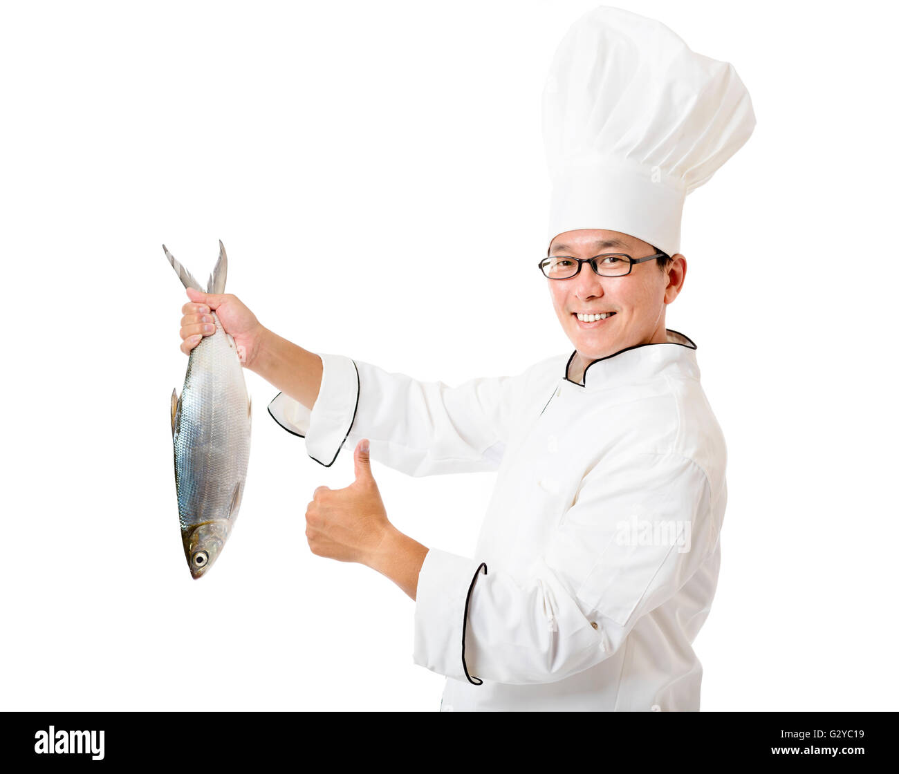 Happy Chef, der große Fisch isoliert auf weiss hält Stockfoto