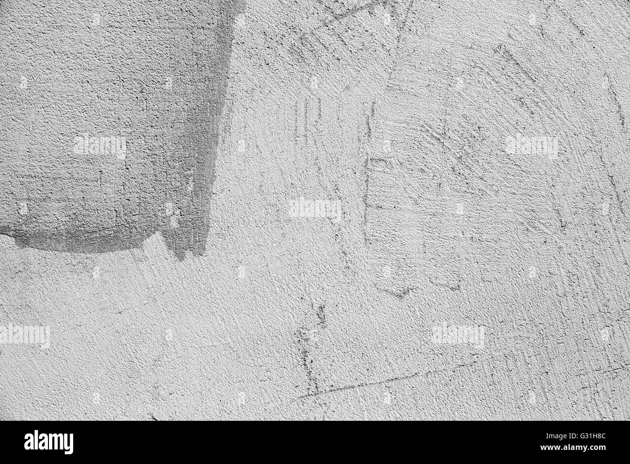 Graue Betonwand mit Stuck Reliefmuster, Foto Hintergrundtextur Stockfoto