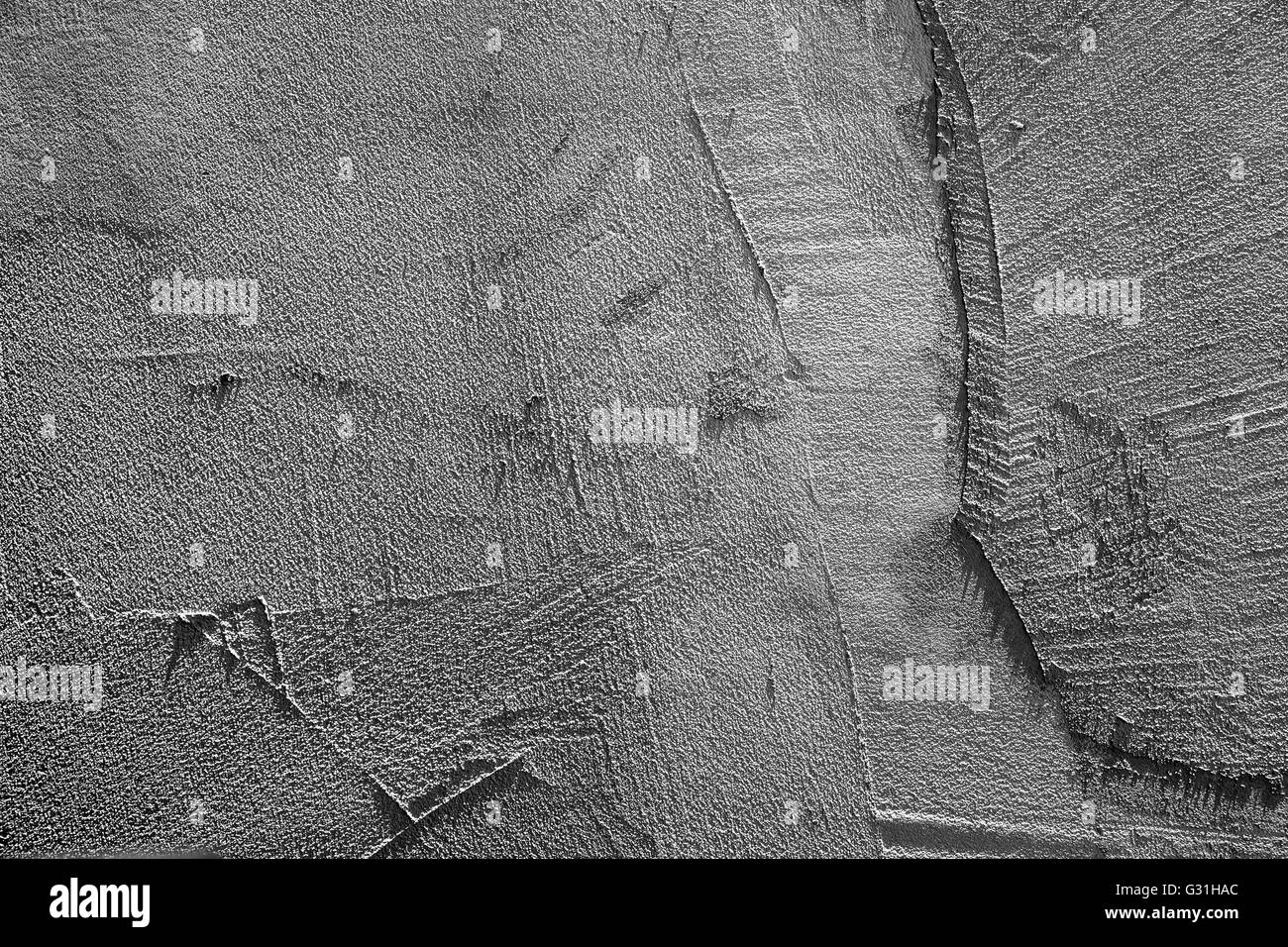 Dunkel graue Betonwand mit Stuck Reliefmuster, Foto Hintergrundtextur Stockfoto