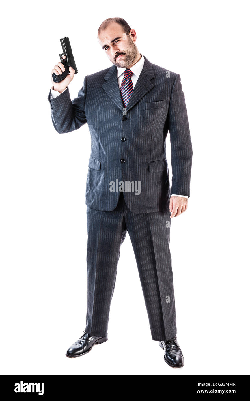 Porträt eines stilvollen Geschäftsmann, Gangster oder Wachmann mit einer Pistole auf einem weißen Hintergrund isoliert Stockfoto