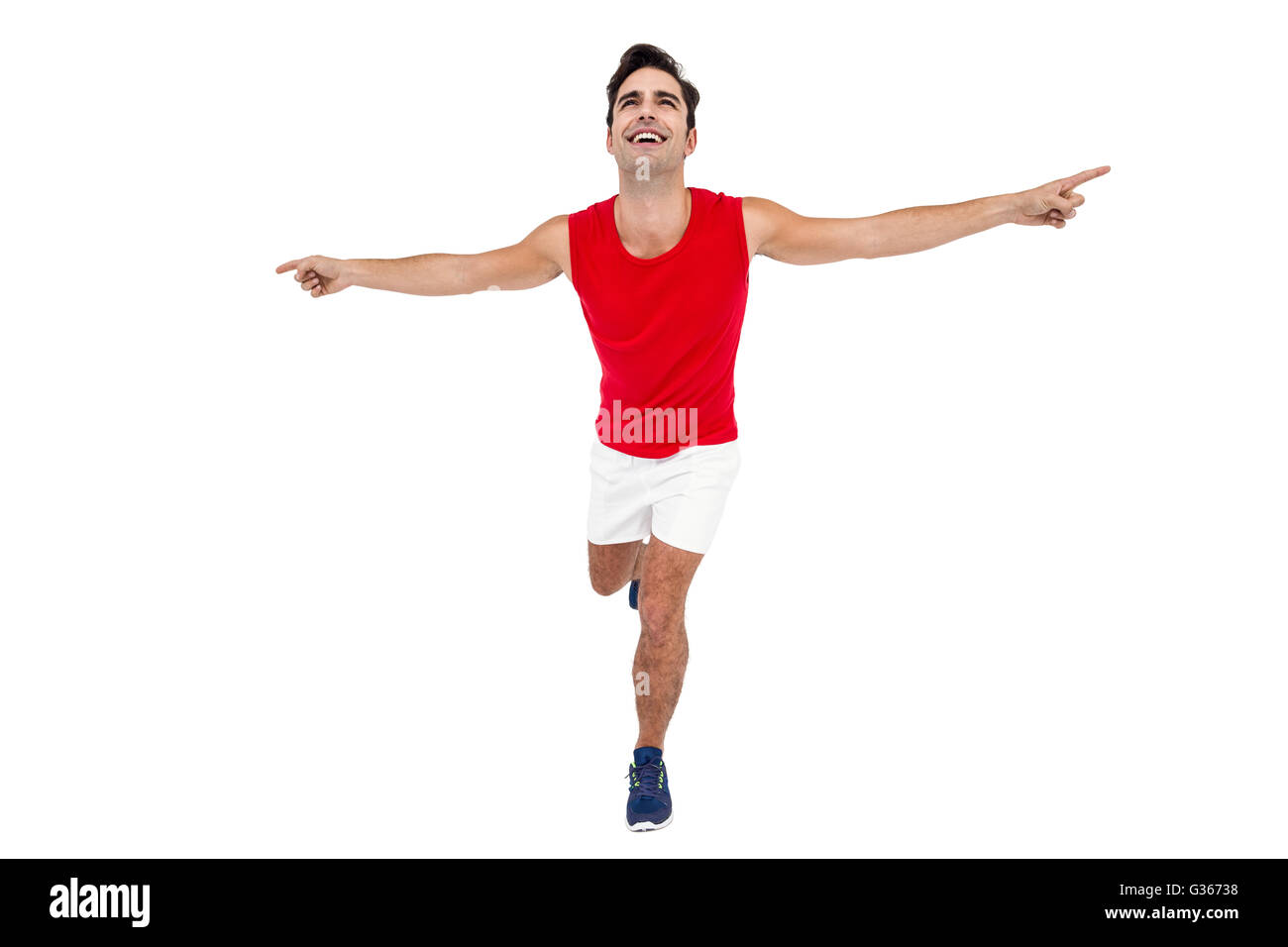 Aufgeregt männlicher Athlet mit ausgestreckten Armen Stockfoto