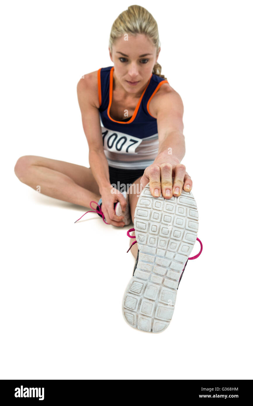 Sportliche Frau dehnen ihre Achillessehne Stockfoto