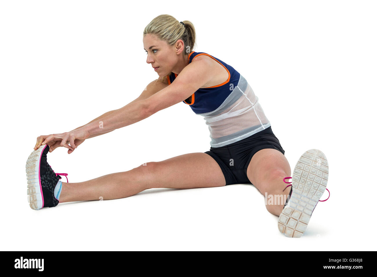 Sportliche Frau dehnen ihre Achillessehne Stockfoto