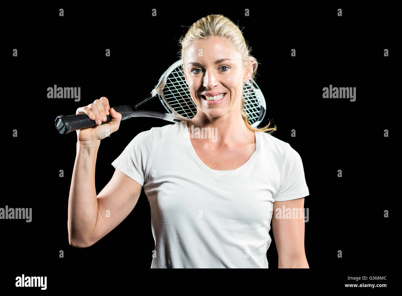 Porträt von Tennisspielerin posiert mit Schläger Stockfoto