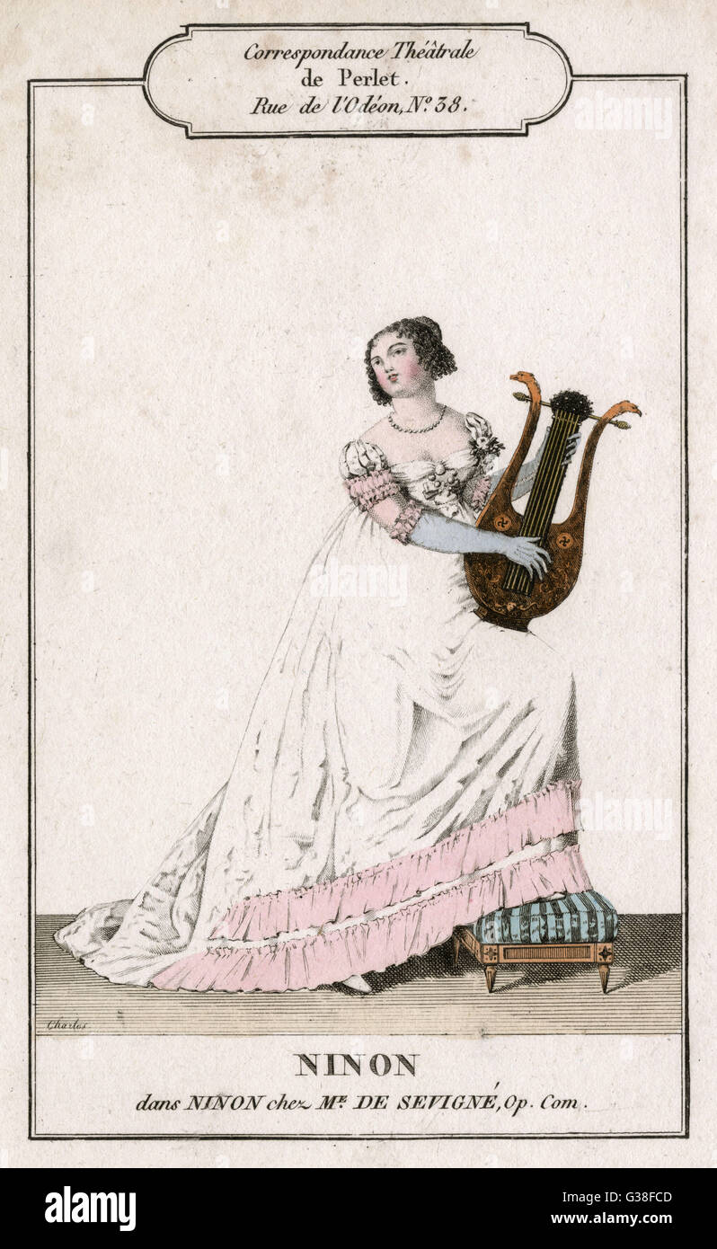 Eine Dame spielt einen Lyre Stockfoto