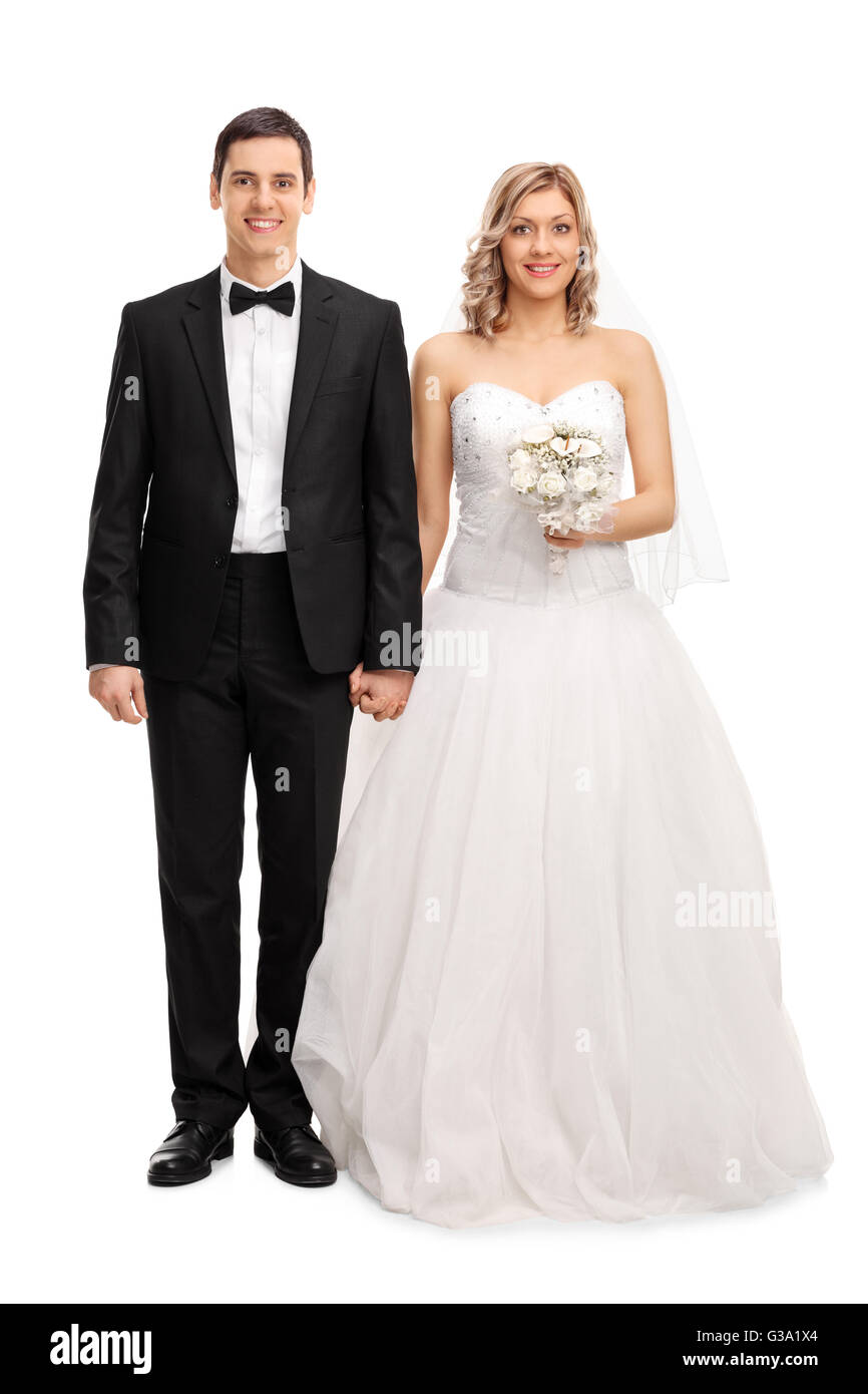In voller Länge Portrait von einem jungen frisch vermählte Paar posing isoliert auf weißem Hintergrund Stockfoto