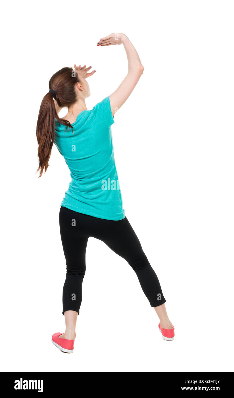 hinten Sie Ansicht von. Frau in Sportbekleidung Hände von dem, was fällt von oben. Hintere Ansicht Menschen Sammlung. Rückseite Blick auf Person. Isoliert auf weißem Hintergrund. Sportlerin Hände geschützt vor dem Absturz von der Spitze des Objekts. Stockfoto