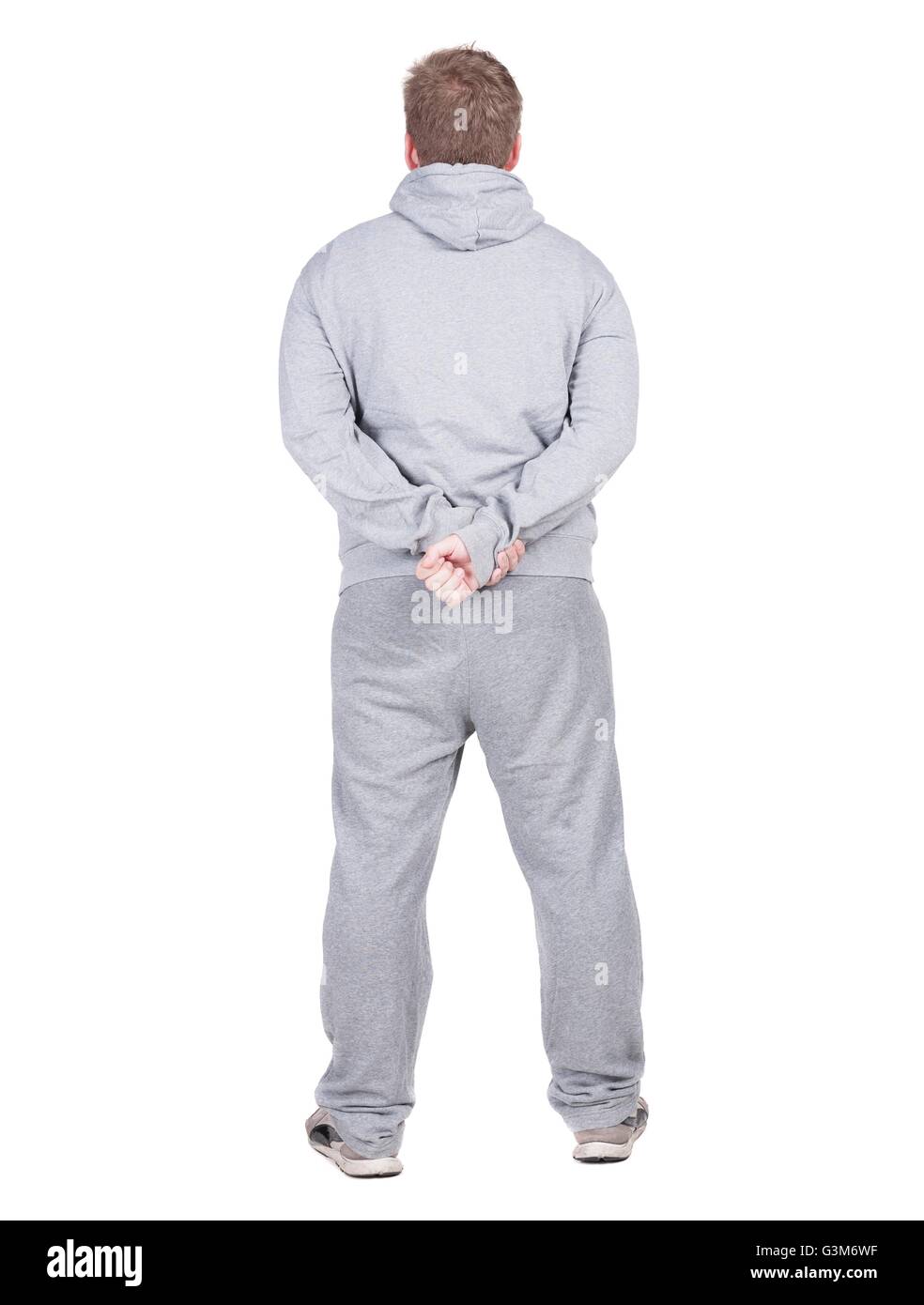 Rückansicht des jungen Athleten Kerl schaut Weg. Sicht nach hinten. Isoliert auf weißem Hintergrund. Stockfoto