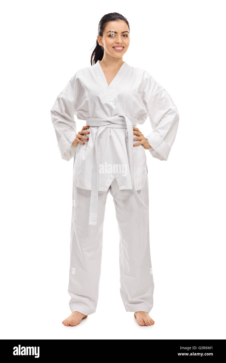 In voller Länge Portrait von einem jungen weiblichen Kampfkünstler in einem weißen Kimono isoliert auf weißem Hintergrund Stockfoto