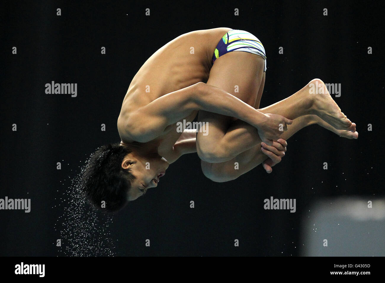 Malaysias Tze Ooi in Aktion bei der 10m Platform Diving am 10. Tag der Commonwealth Games 2010 beim Dr. S.P.M. Aquatics Complex in Delhi, Indien Stockfoto