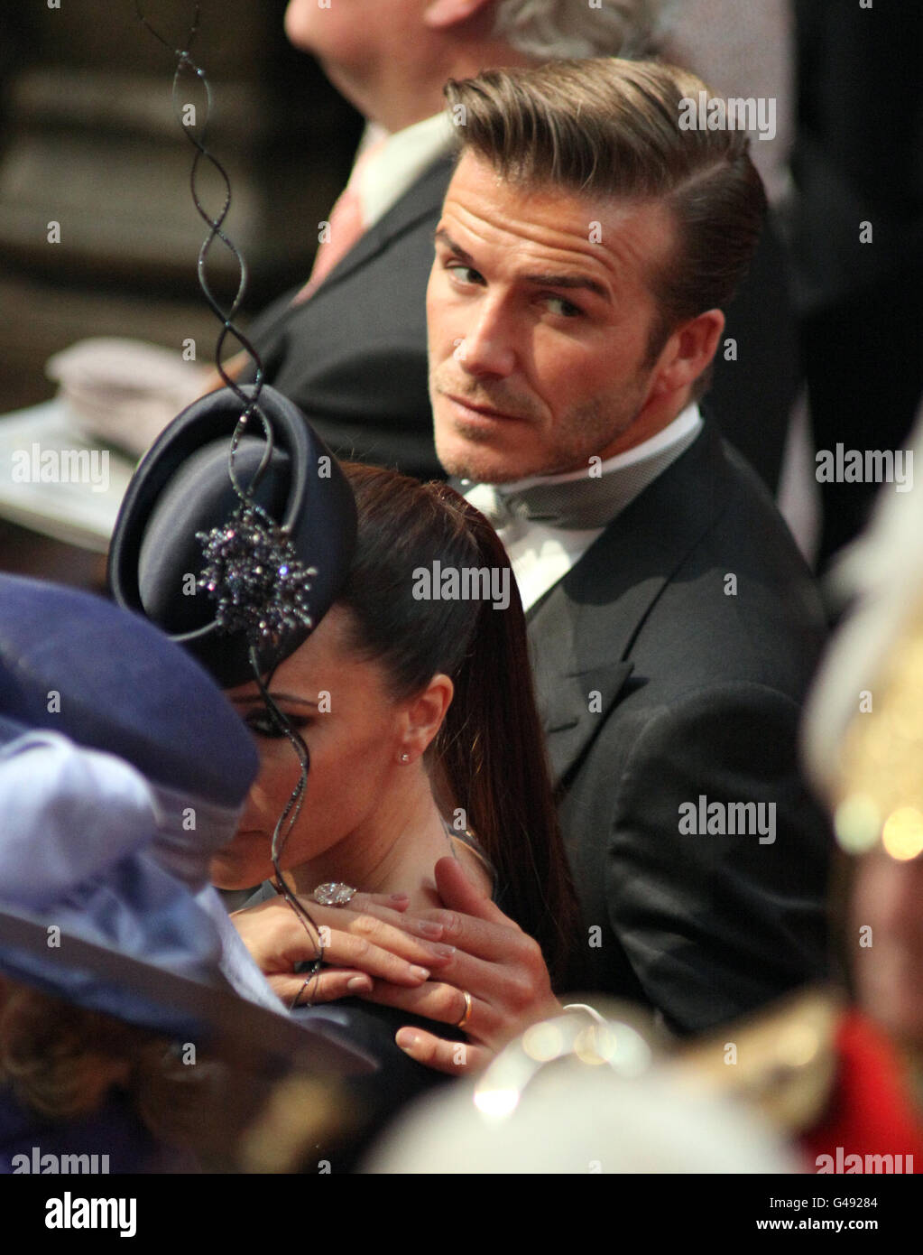 David und Victoria Beckham vor der Hochzeit von Prinz William und Kate Middleton in Westminster Abbey. Stockfoto