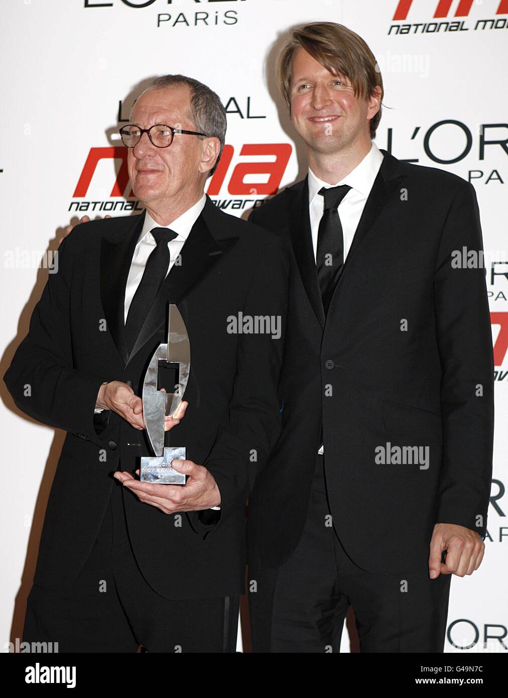 Geoffrey Rush und Tom Hooper wurden bei den National Movie Awards 2011 in der Wembley Arena, London, für das beste Drama ausgezeichnet Stockfoto