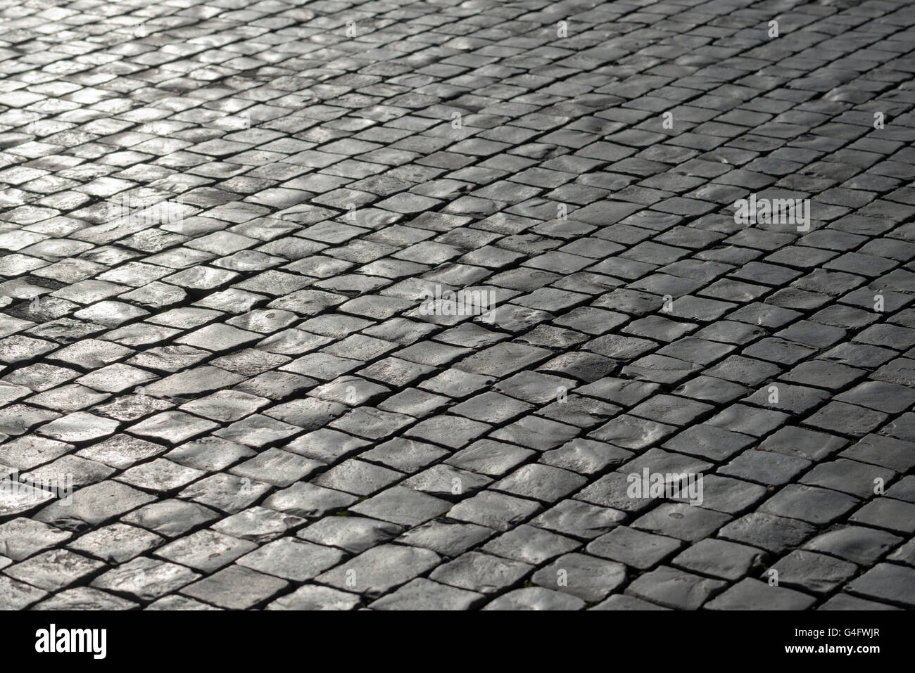 Grauen Stein gepflasterten Hintergrund Stockfoto