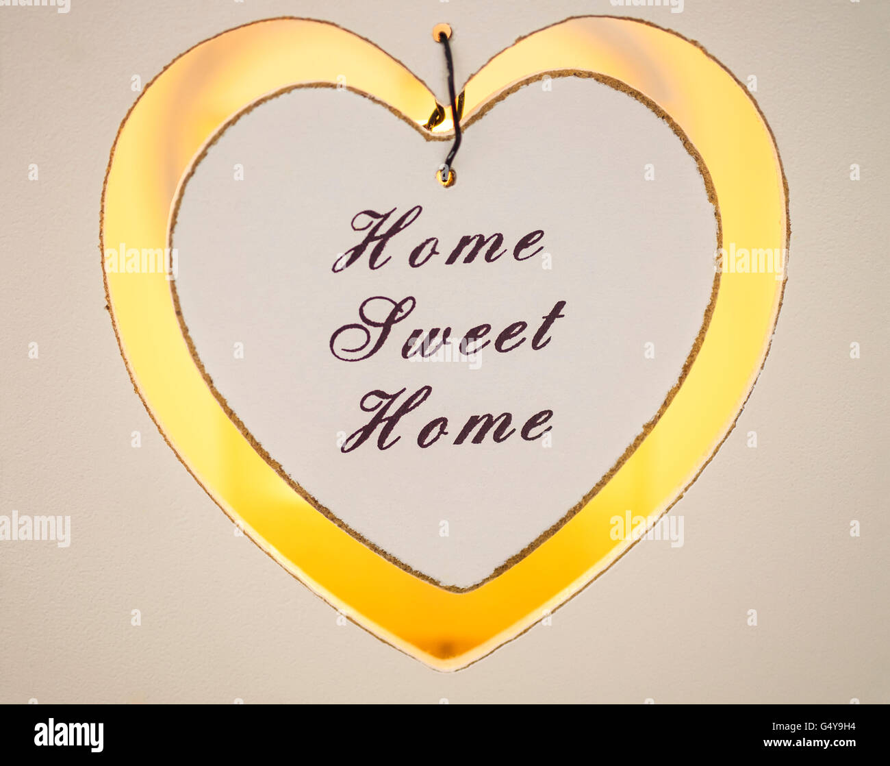 Home Sweet Home Kerze Votiv mit Kerzenlicht Stockfoto