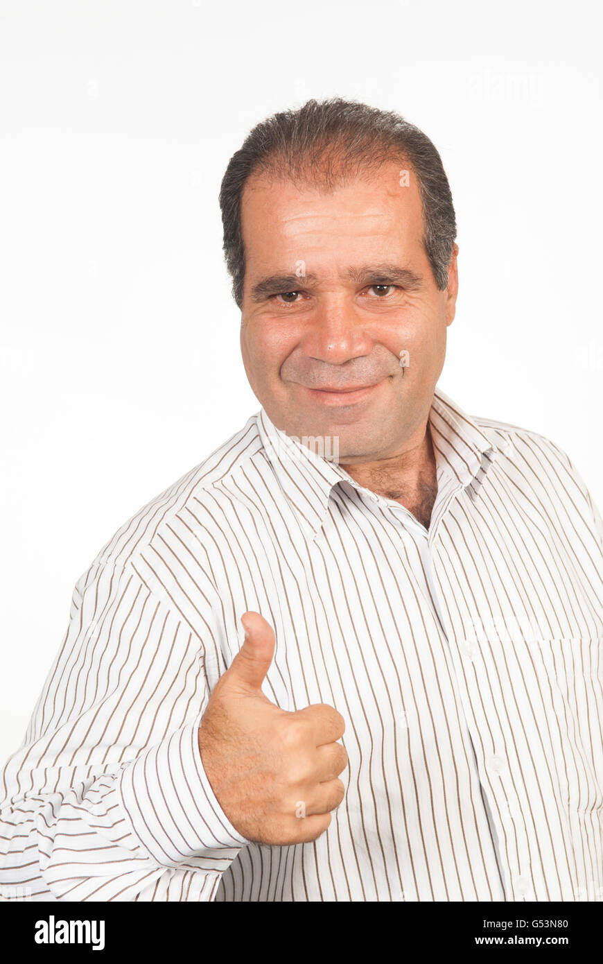 Mann mit Daumen hoch Handgeste vor einem weißen Hintergrund Stockfoto