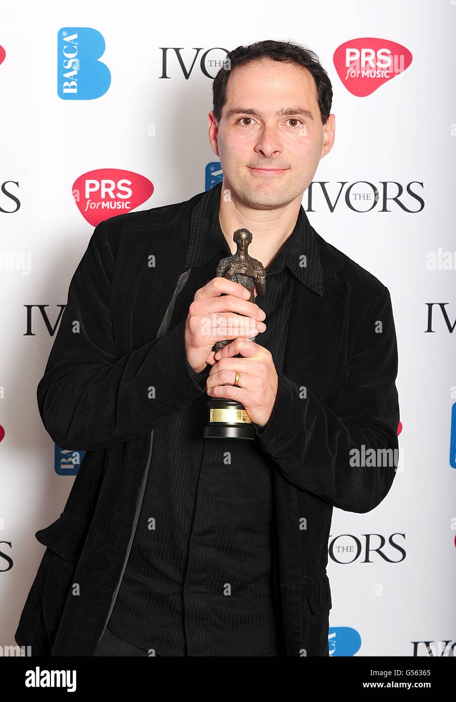 Alex Heffes erhielt den Preis für den besten Originalfilm, den er 2012 im Grosvenor House Hotel, London, erhielt Stockfoto