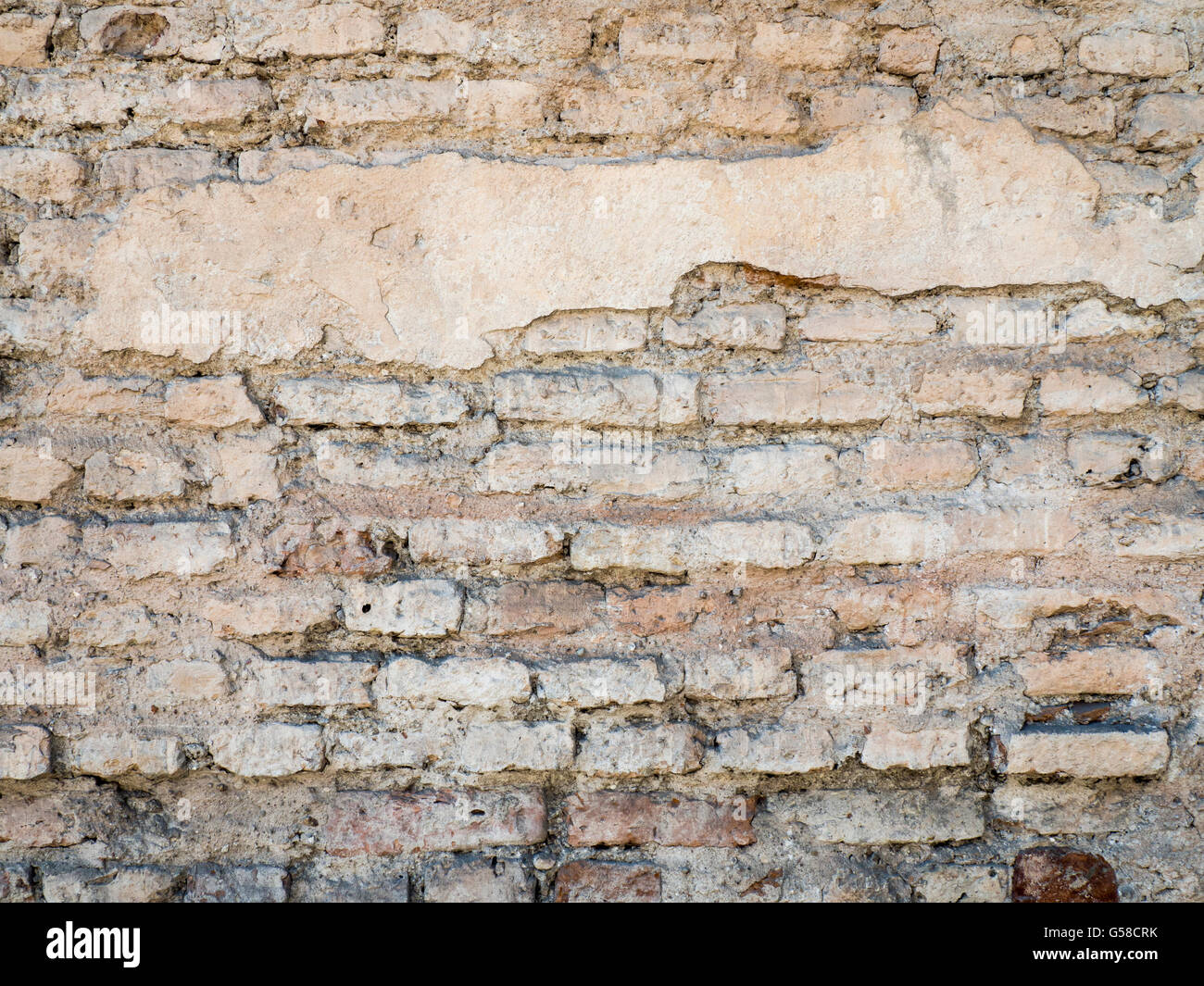 Alte beschädigte rustikalen Ziegelwand mit Gips Textur Hintergrund Stockfoto