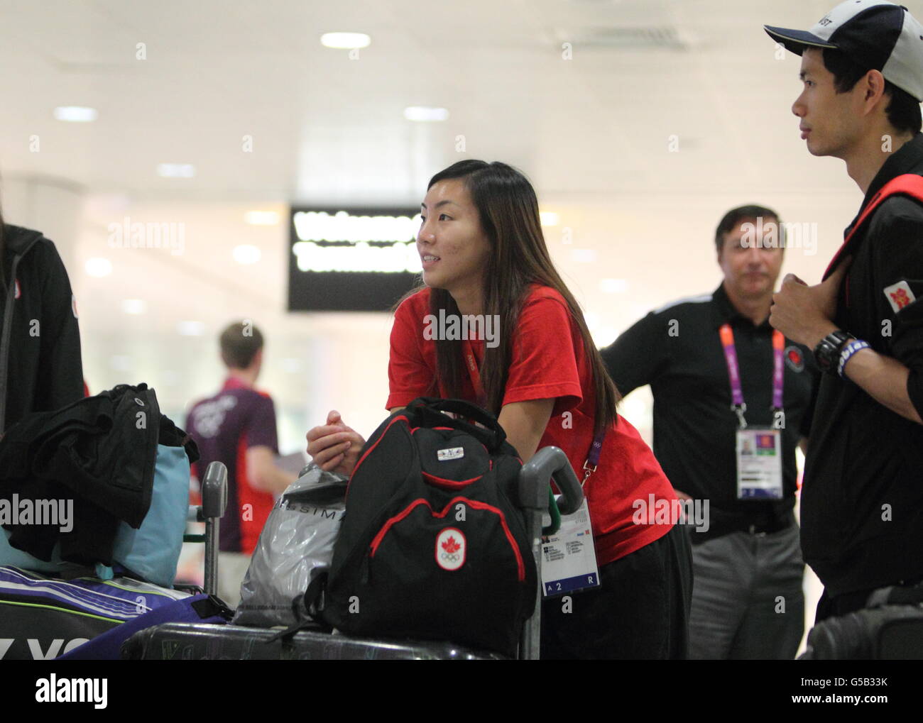 Badmintonspieler der kanadischen Olympiamannschaft kommen am Flughafen Heathrow an. Stockfoto