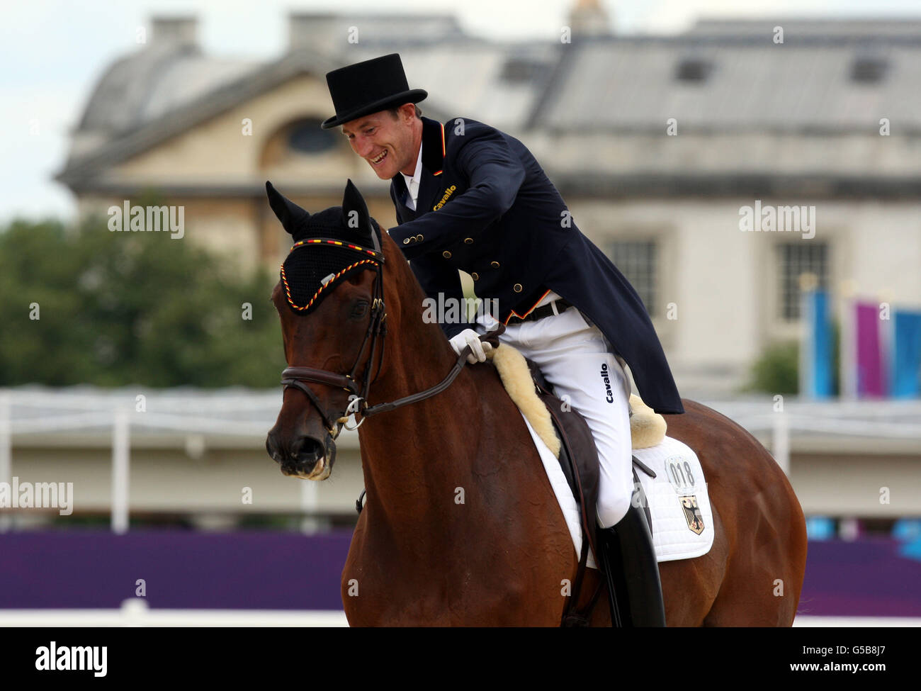 Olympische Spiele In London - Tag 1. Der deutsche Dirk Schrade reitet auf König Artus am ersten Dressurtag der Eventing of im Greenwich Park Stockfoto