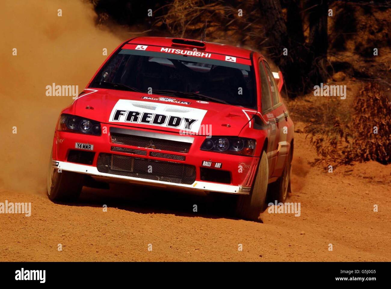 Freddy Loix und sein Beifahrer Sven Smeets in ihrem Mitsubishi Lancer Evolution WRC, während der 1. Etappe der Australian Rally. Stockfoto