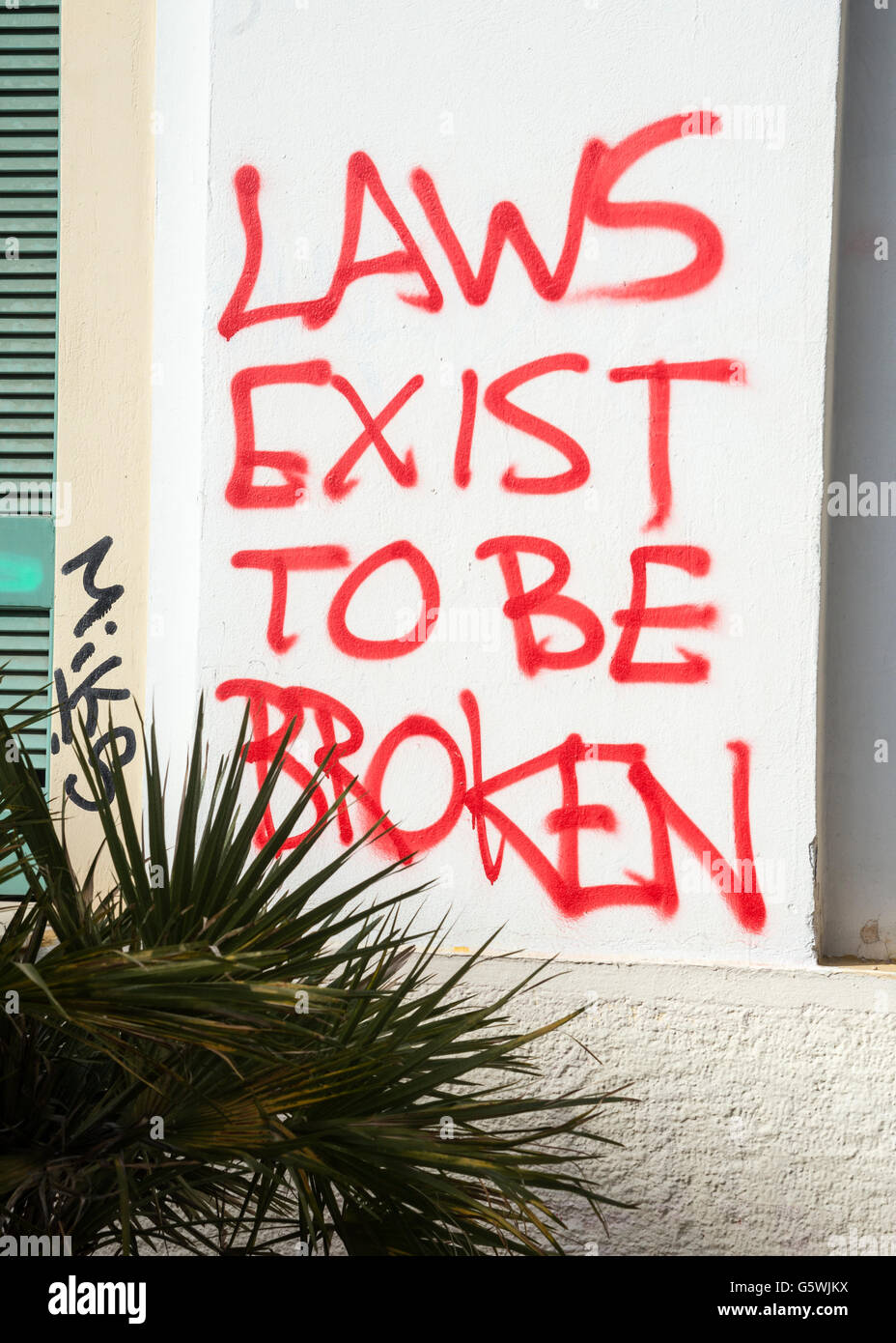 Graffiti, sozialer Kommentar im Stadtteil Psiri Zentrale Athen, Griechenland Stockfoto