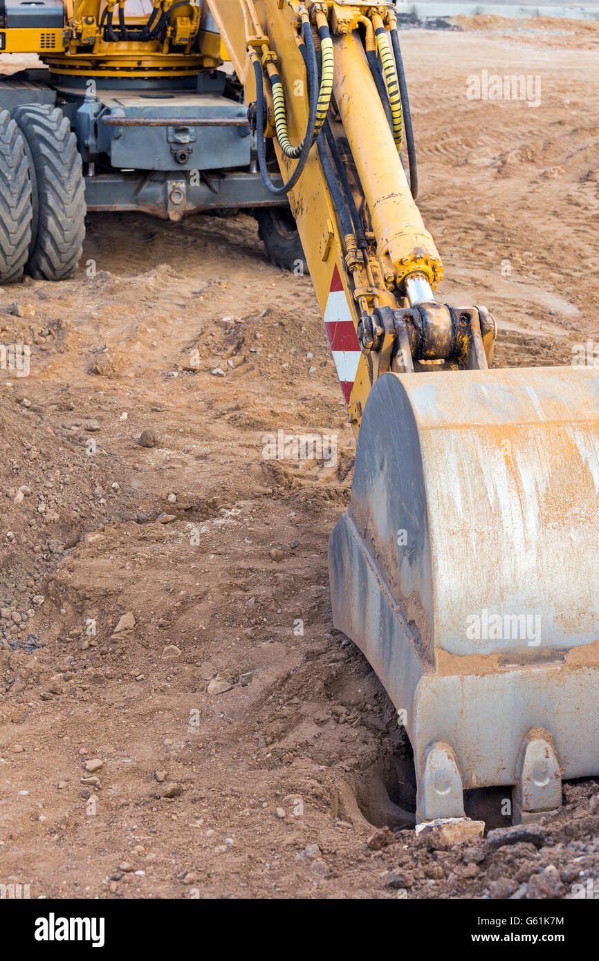 Radlader Bagger mit Tieflöffel auf Baustelle Stockfoto
