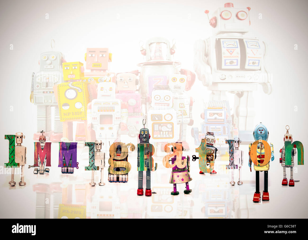 Das Wort Einwanderung mit Retro-Roboter Spielzeug Stockfoto