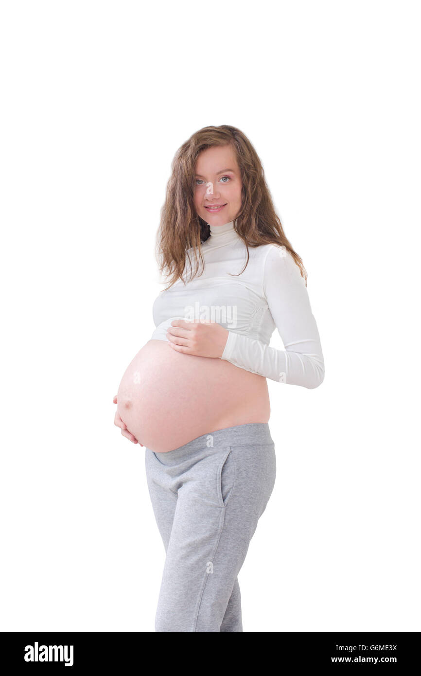 Schwangere Frau streichelt ihren Bauch, isoliert Stockfoto