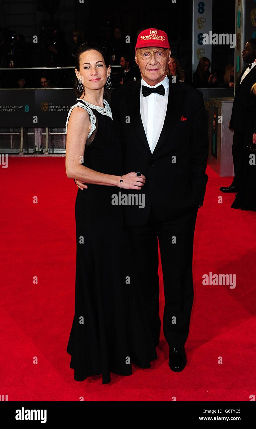 Niki Lauda und Birgit Wetzinger bei den EE British Academy Film Awards 2014 im Royal Opera House, Bow Street, London. Stockfoto