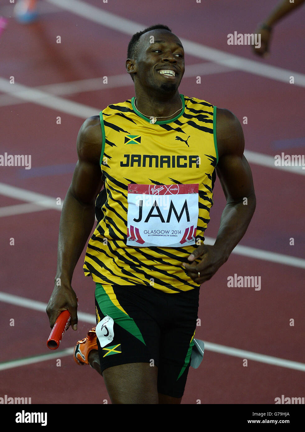 Jamaikas Usain Bolt feiert den Gewinn der Männer 4x100 m Staffel im Hampden Park, während der Commonwealth Games 2014 in Glasgow. Stockfoto