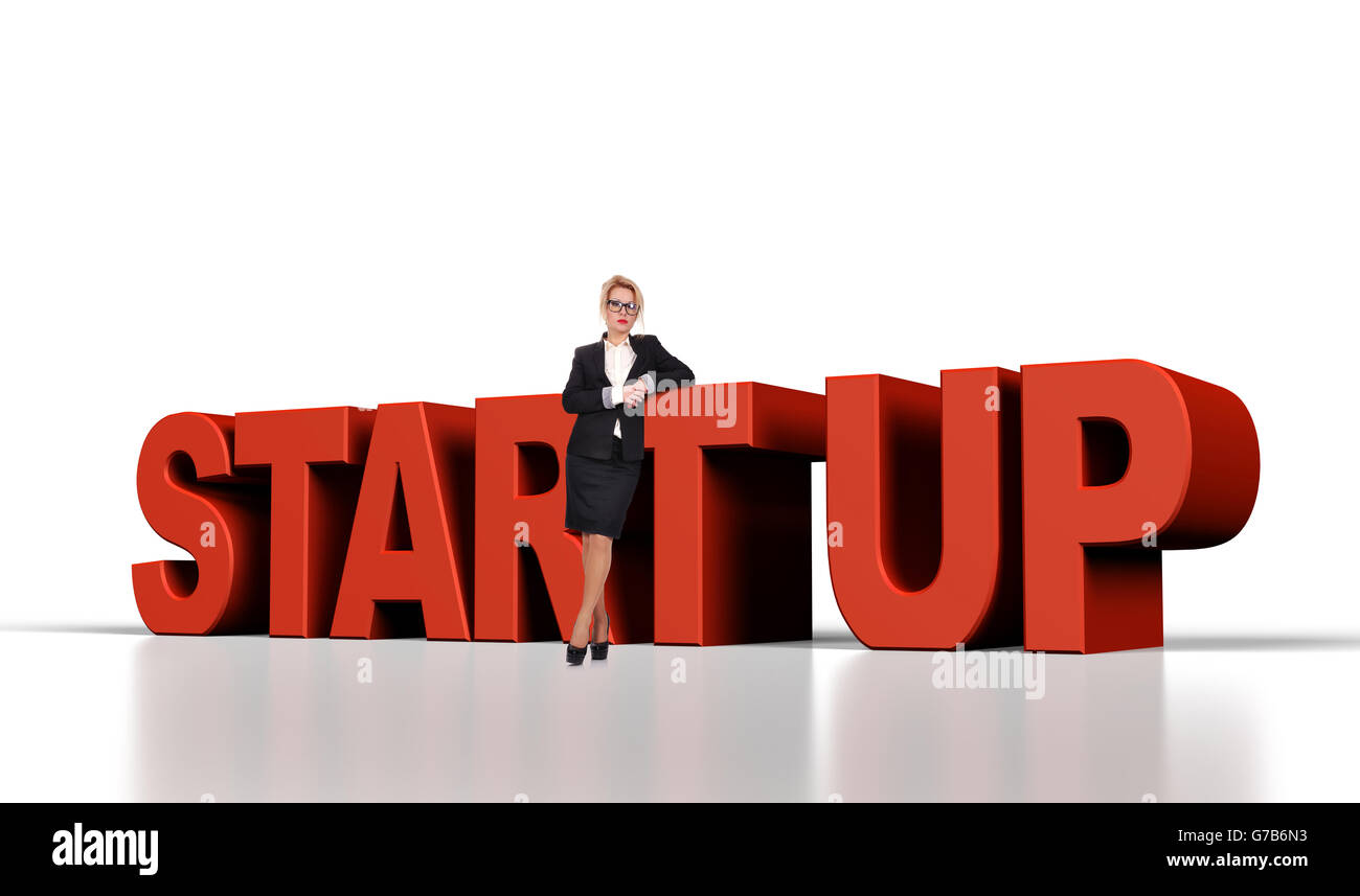 Geschäftsfrau steht in der Nähe von roten Start-up-text Stockfoto