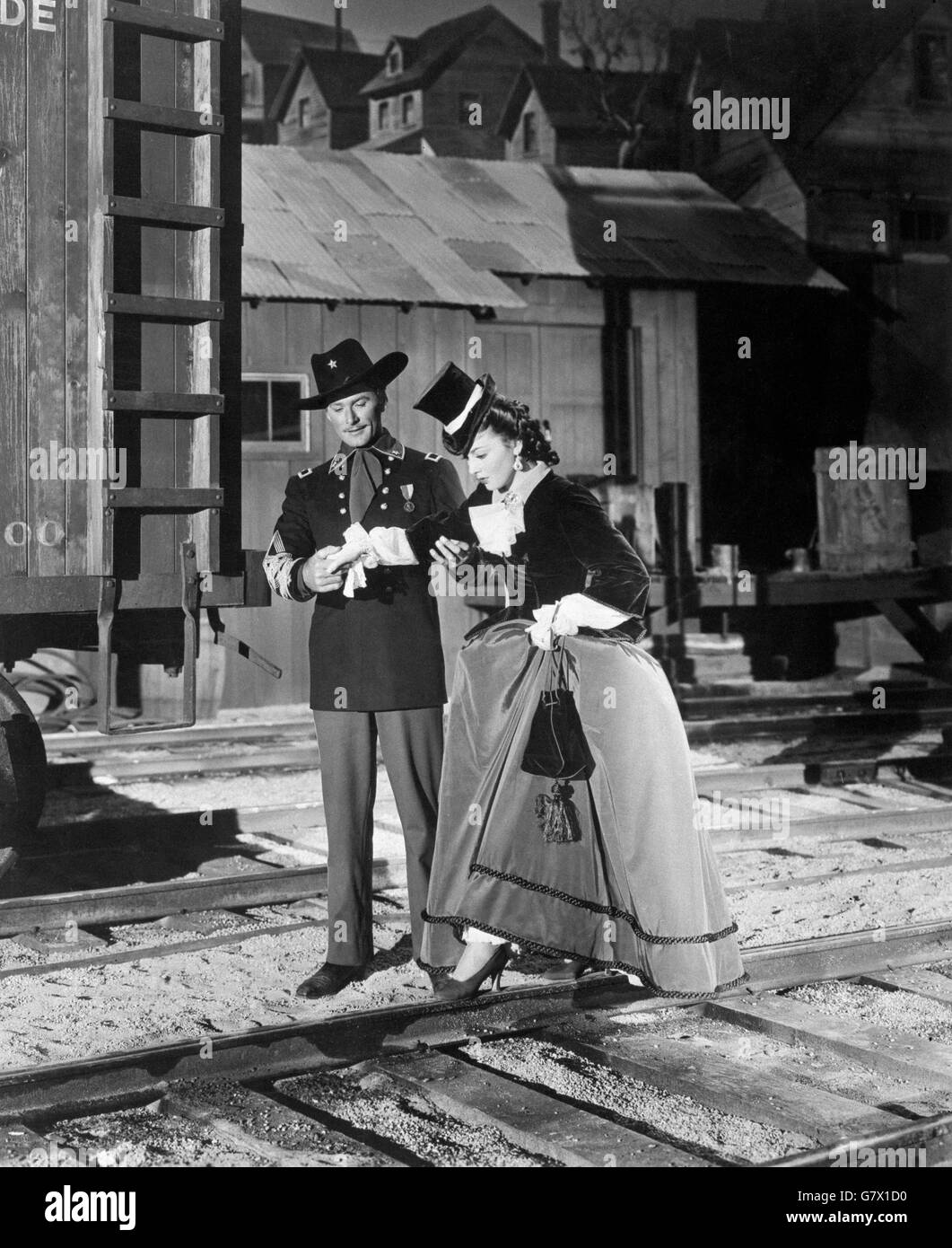 Errol Flynn und Olivia de Havilland in einer Szene aus dem Film Sie starben mit ihren Boots On. Stockfoto