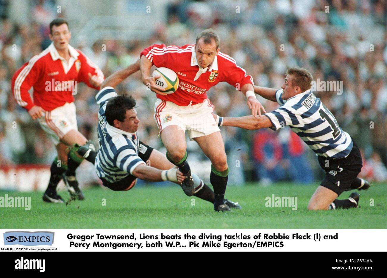 Gregor Townsend, Lions schlägt die Tauchgänge von Robbie Fleck (l) und Percy Montgomery, beide W.P Stockfoto