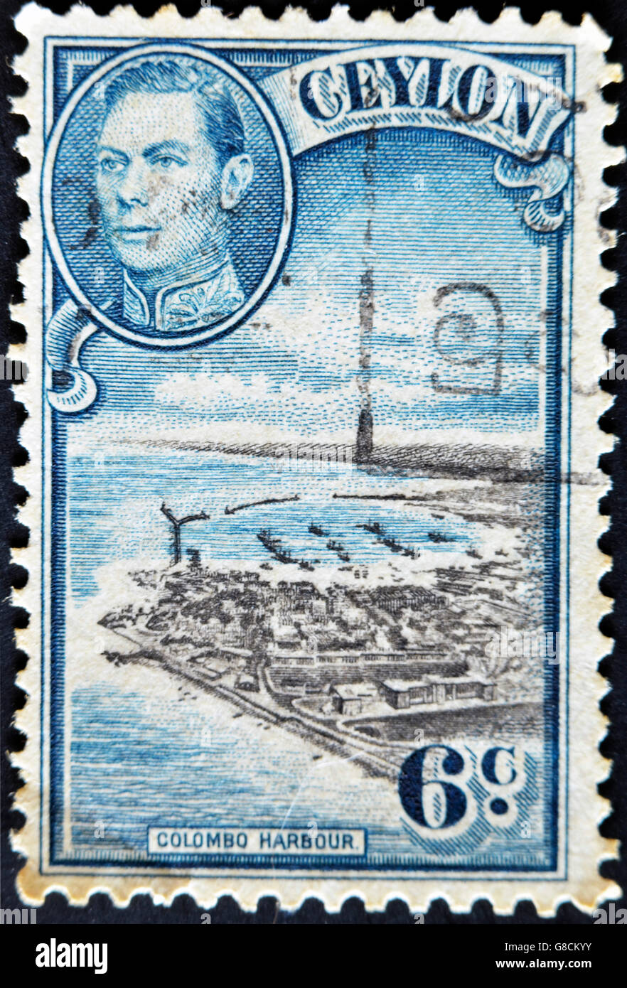 CEYLON-ca. 1937:A Stempel gedruckt in Ceylon zeigt Bild The Colombo Hafen und König George VI, ca. 1937 Stockfoto