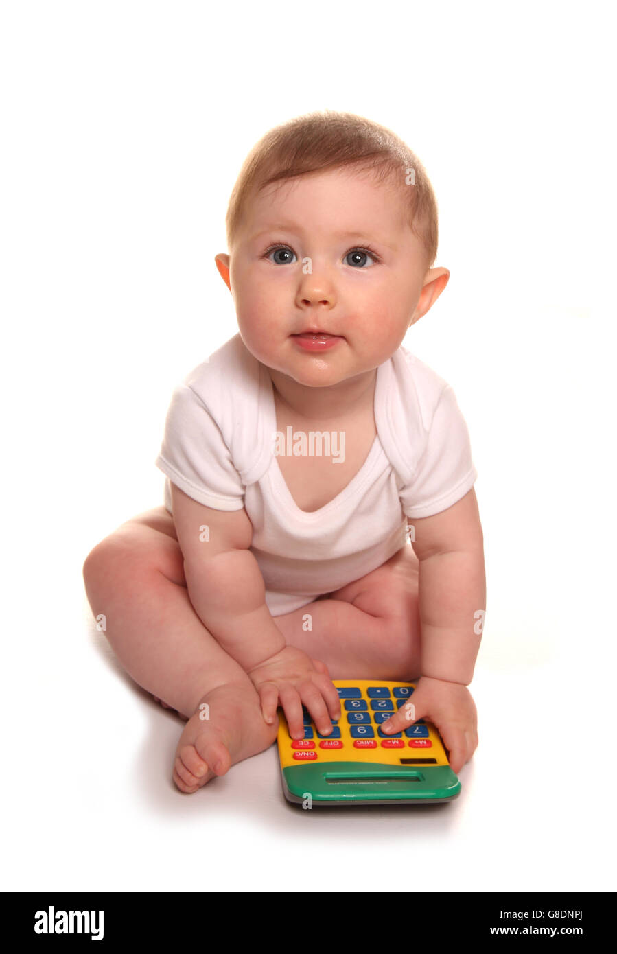 Babymädchen spielen mit einem Taschenrechner-Ausschnitt Stockfoto