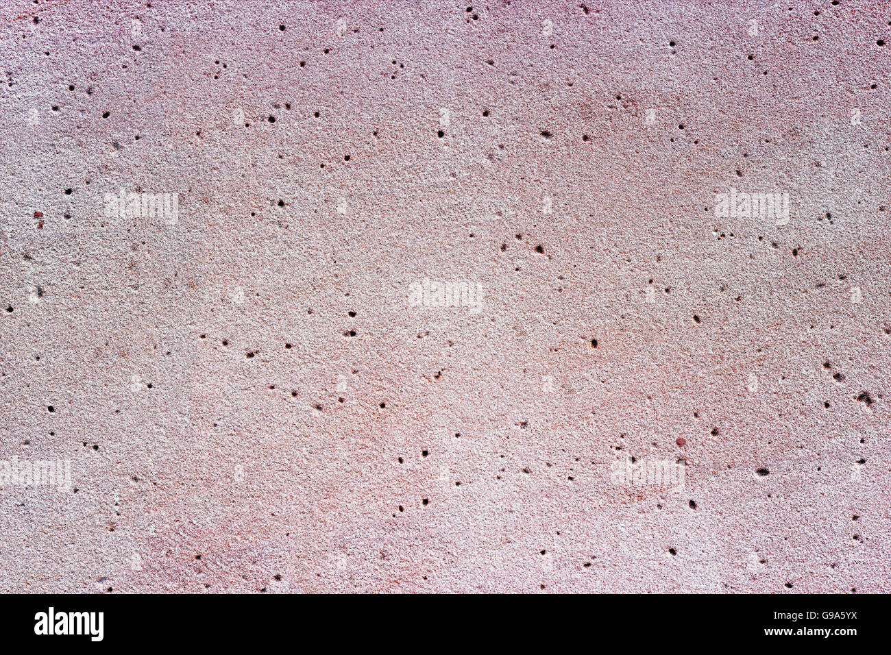 Hellem Sandstein mit kleinen Löchern als Hintergrundbild Stockfoto