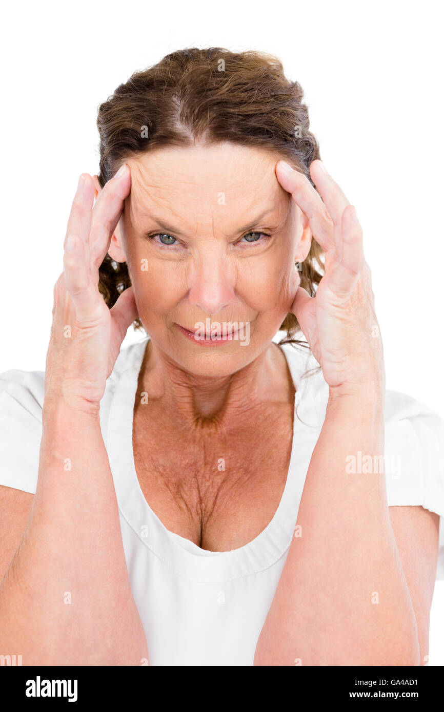 Porträt von Reife Frau mit Kopf in Händen Stockfoto