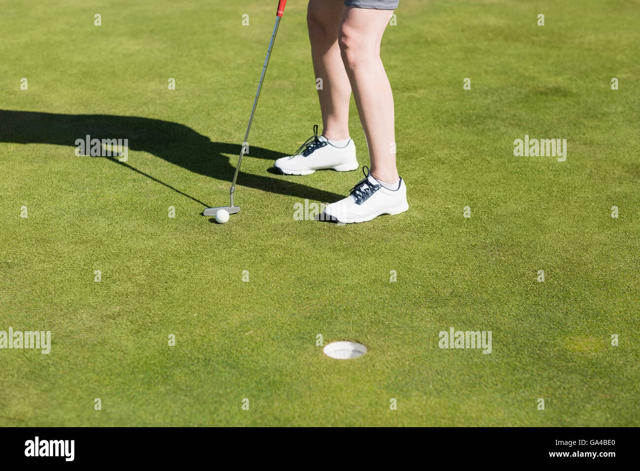 Geringen Teil der Frau mit Golf club Stockfoto