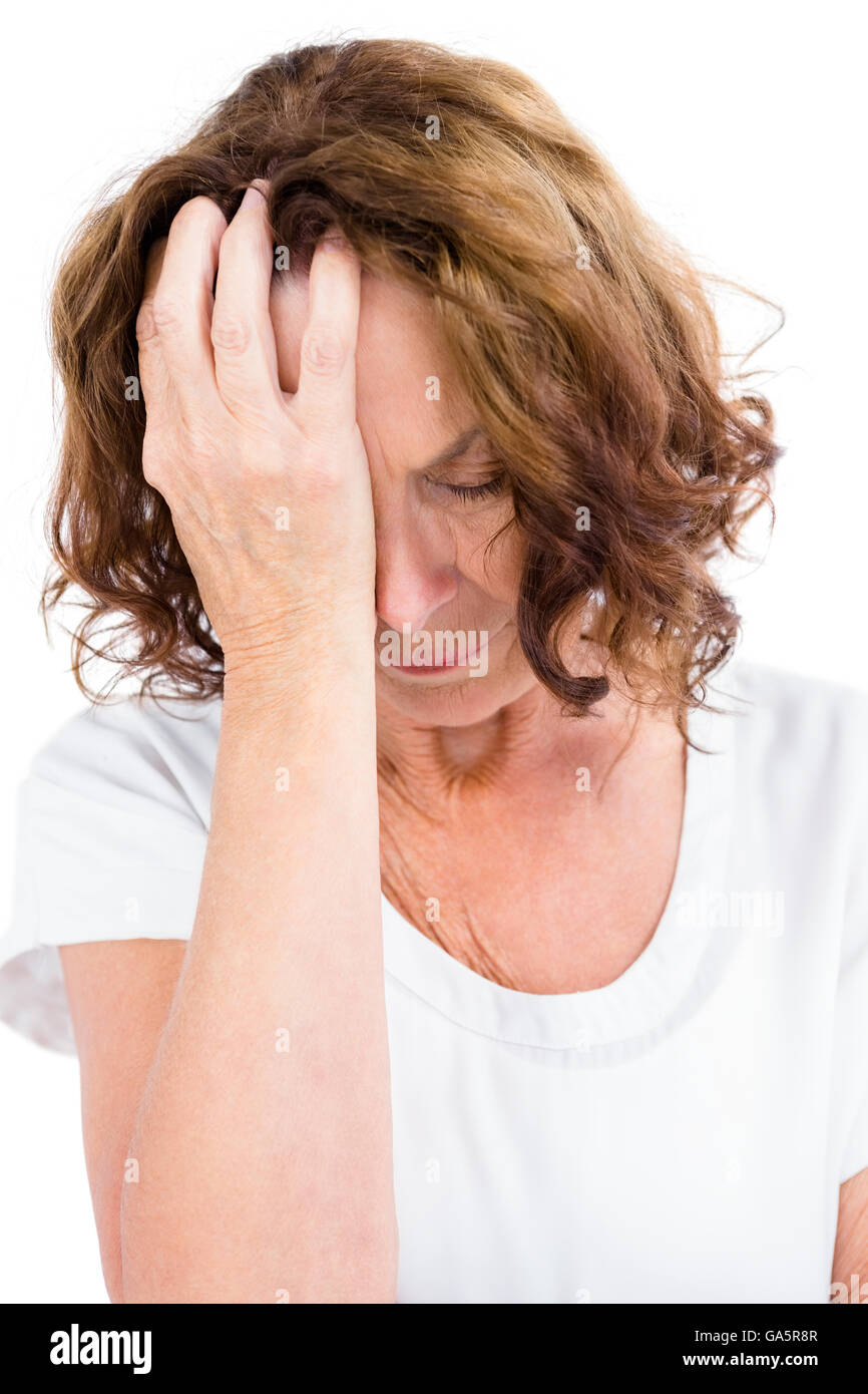 Reife Frau mit Kopf in der hand stören Stockfoto