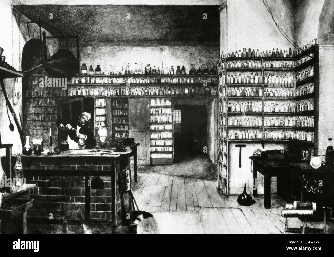 Michael Faraday (1791-1867). Englischer Physiker und Chemiker. Faraday in seinem Labor. Gravur. Stockfoto