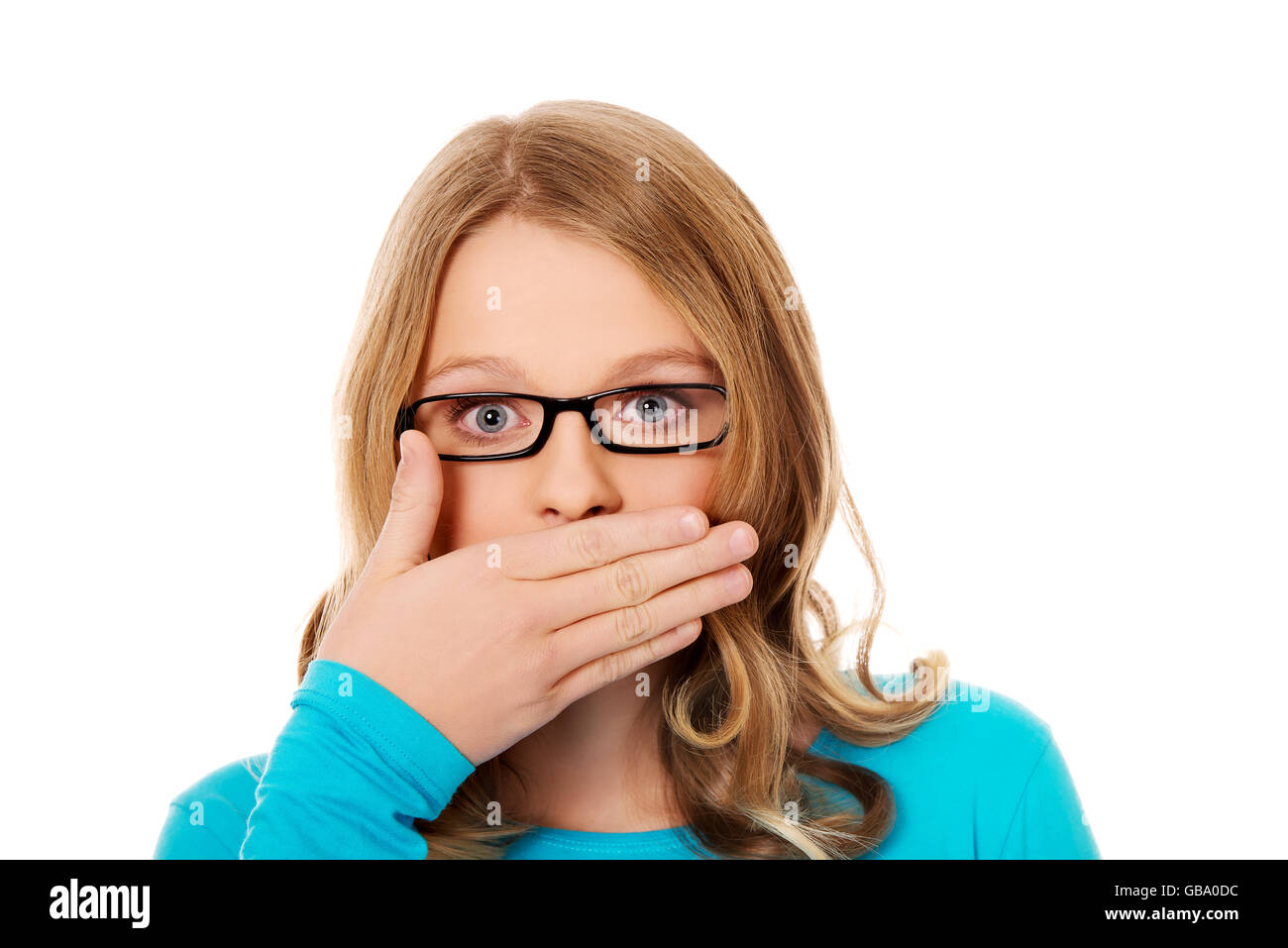 Teenager, die ihr den Mund zu Stockfoto