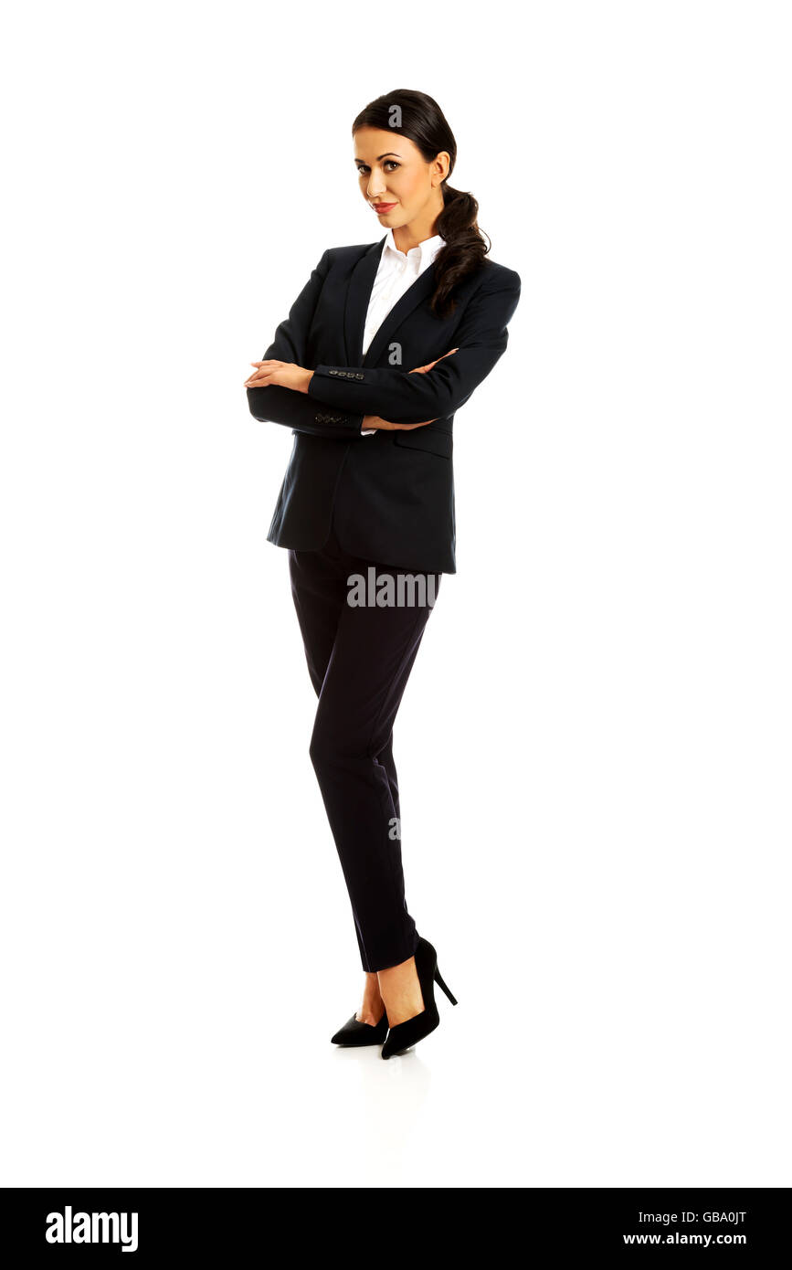 Geschäftsfrau Stand mit verschränkten Armen Stockfoto
