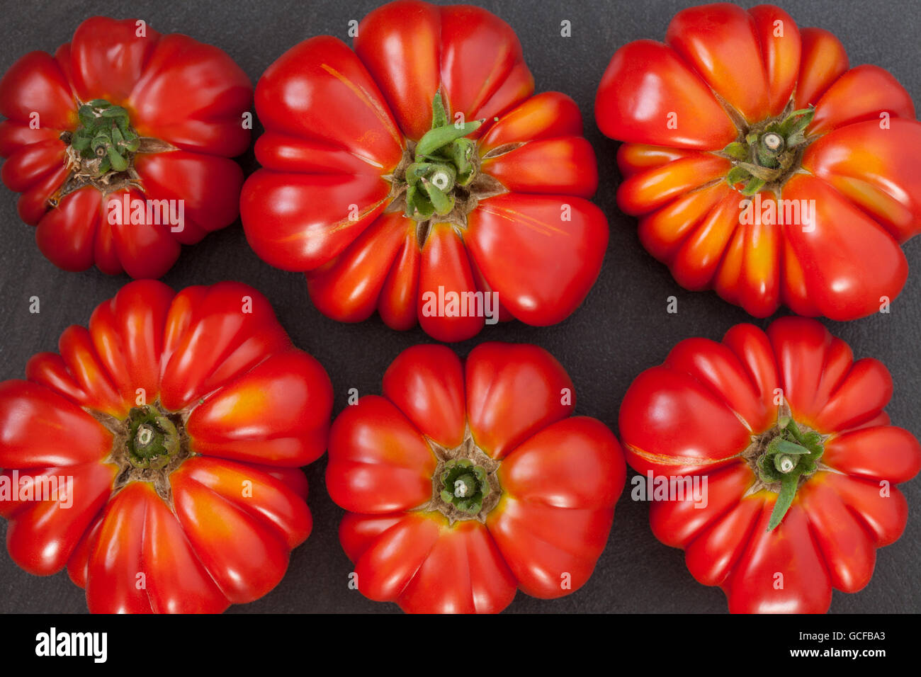 Erbstück-Tomaten-Hintergrund Stockfoto