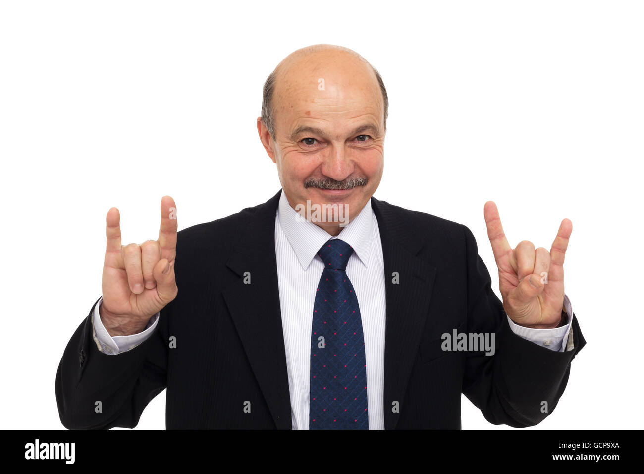 Amateur Rock-Musik bei einem Geschäftstreffen. beleben Sie alte. Älterer Mann in einem Anzug zeigt ein Zeichen der Hörner Stockfoto