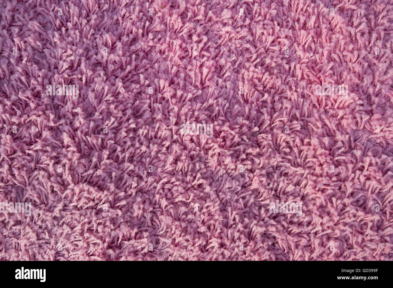 echte violetten Teppich oder Handtuch Textur als Hintergrund entwerfen Stockfoto