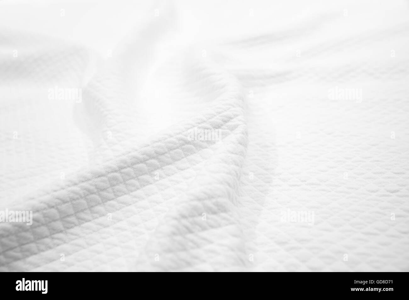 Weiße Baumwolle Stoff Textur, Hintergrundfoto wellenförmige Decke Stockfoto