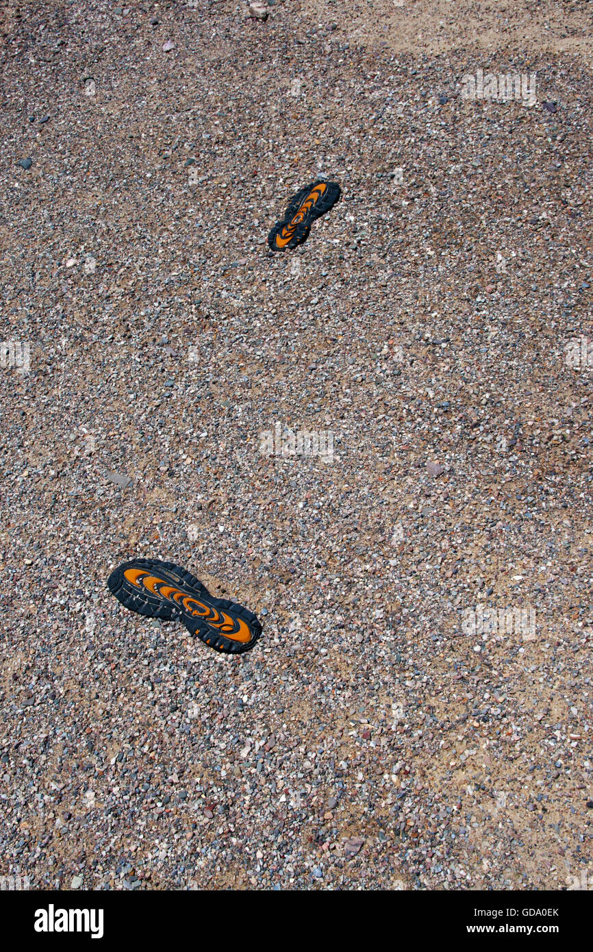 Schuhsohlen fand in Sand Stockfoto