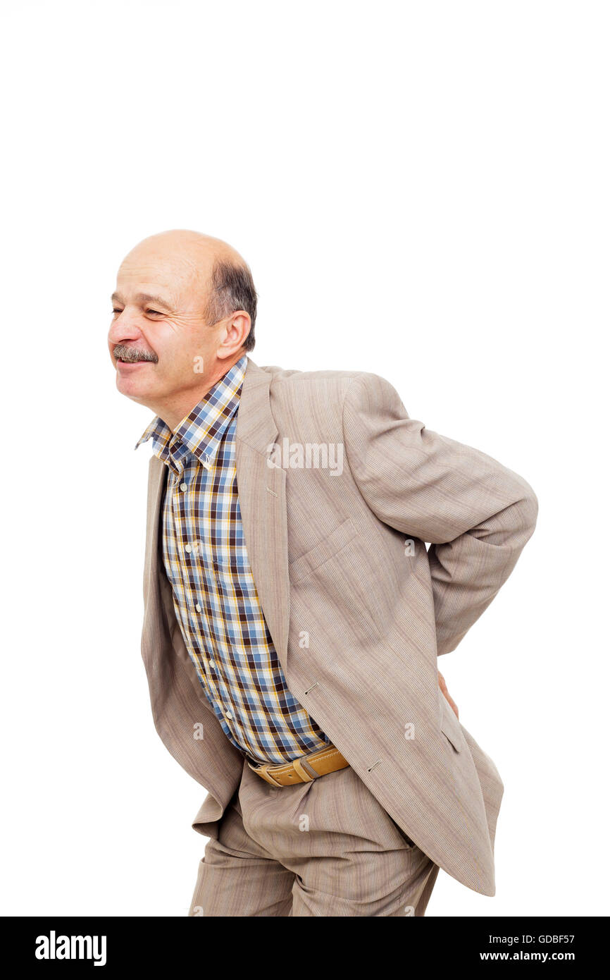 Älterer Mann hält am unteren Rücken und zuckte zusammen. Stockfoto