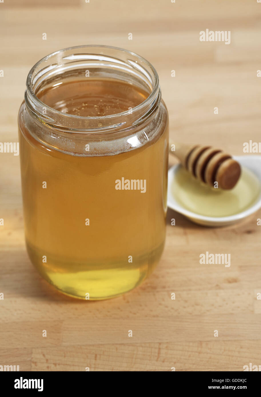 Topf Honig mit Honig-Löffel Stockfoto